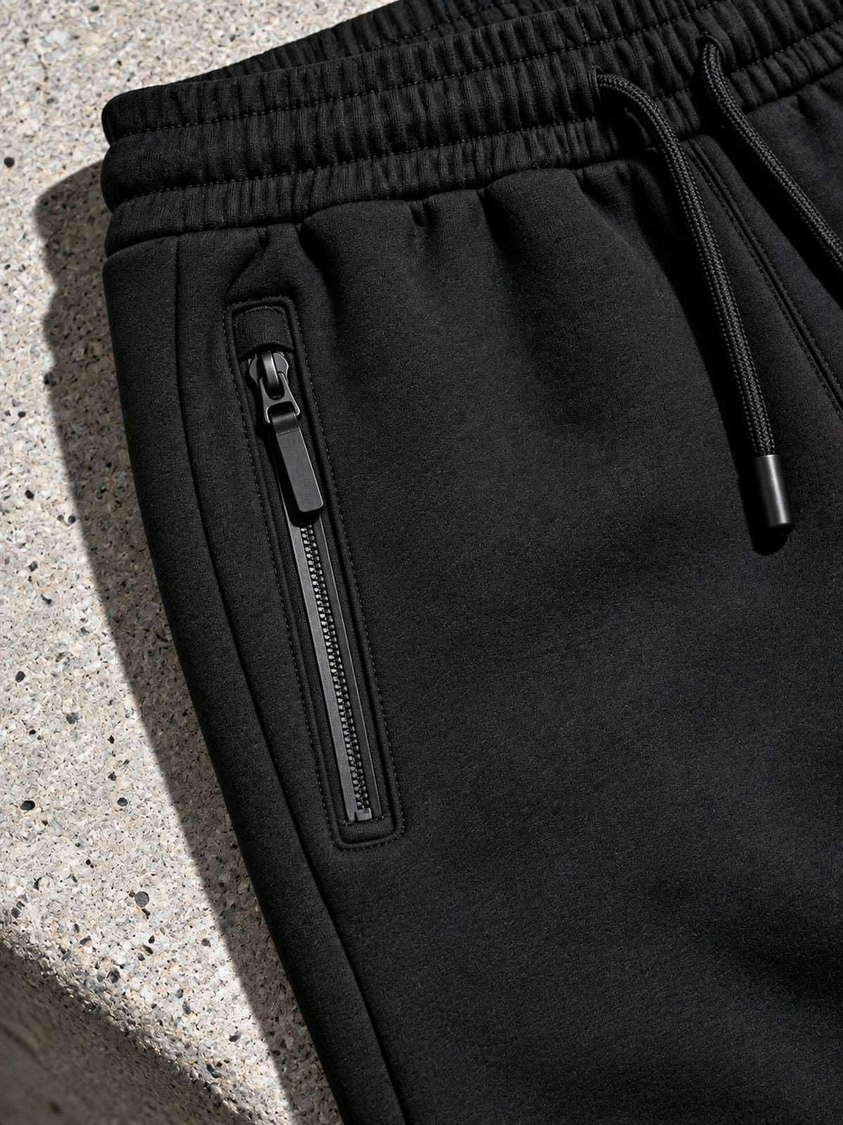 Jogger Tech Fleece noir, poche zippée